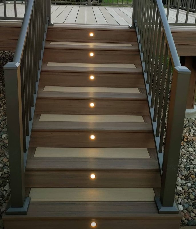 Composite deck stairs with step lighting at night