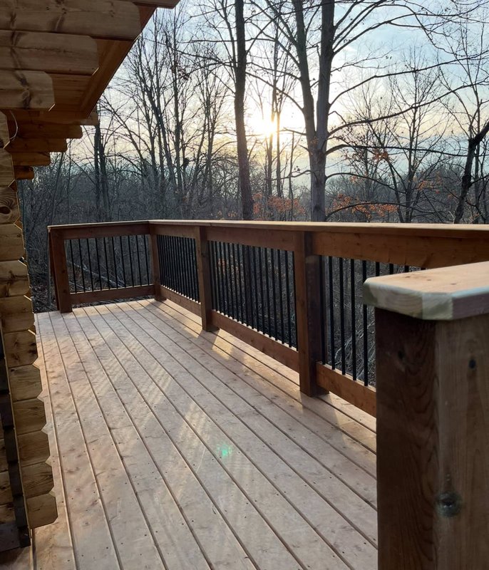 Cedar deck railing at sunset